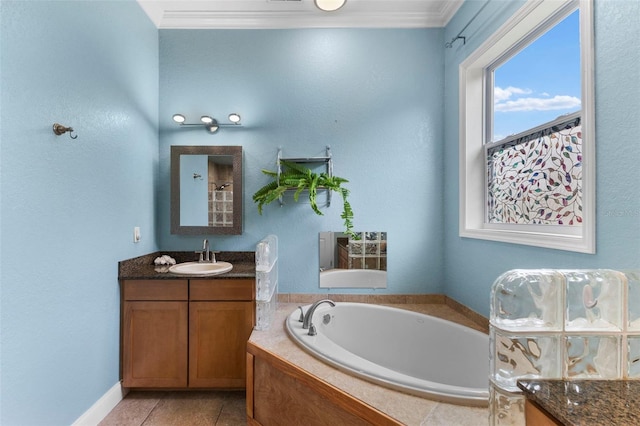 bathroom with tile patterned flooring, a garden tub, vanity, and crown molding