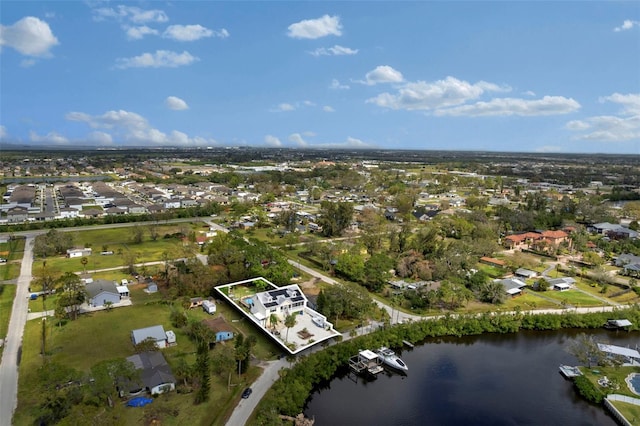 birds eye view of property featuring a residential view and a water view