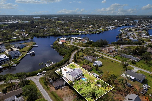 birds eye view of property featuring a water view