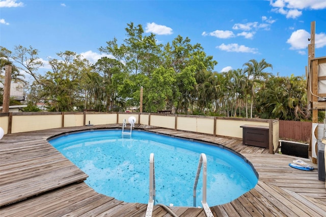 view of pool featuring a deck and a fenced in pool