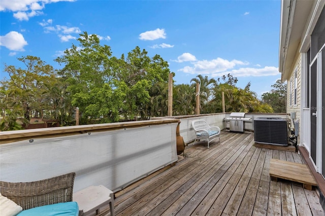 deck with cooling unit and area for grilling