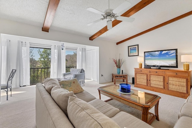 2446 Clubhouse Cir Unit 202, Sarasota, FL 34232 - living room with a ceiling fan, vaulted ceiling with beams, light carpet, and a textured ceiling