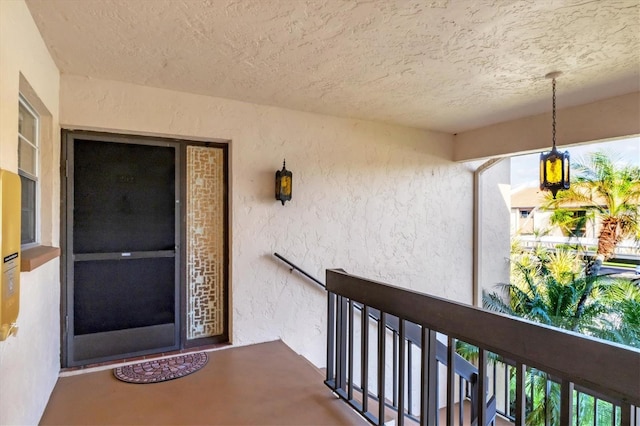2446 Clubhouse Cir Unit 202, Sarasota, FL 34232 - doorway to property featuring stucco siding and a balcony