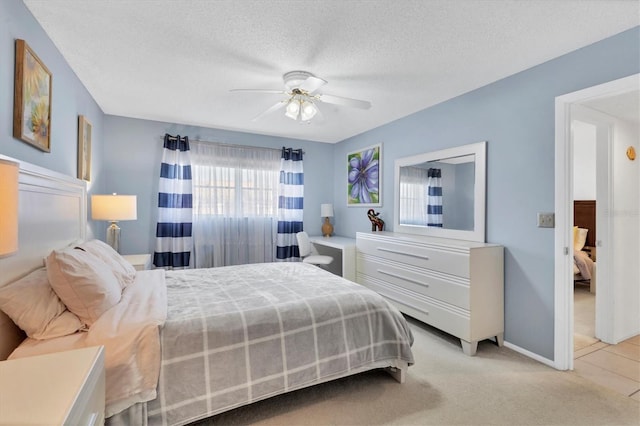 2446 Clubhouse Cir Unit 202, Sarasota, FL 34232 - bedroom with baseboards, ceiling fan, a textured ceiling, and light colored carpet