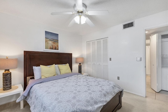 2446 Clubhouse Cir Unit 202, Sarasota, FL 34232 - bedroom featuring a closet, ceiling fan, and light carpet