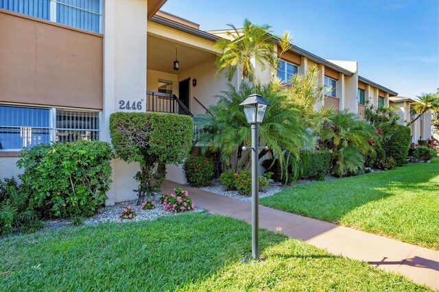 2446 Clubhouse Cir Unit 202, Sarasota, FL 34232 - view of community featuring a lawn