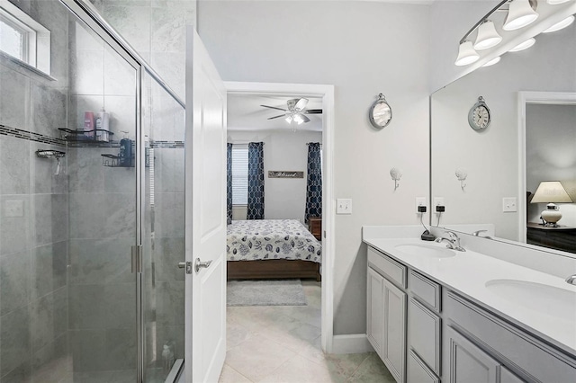 ensuite bathroom featuring double vanity, a stall shower, a sink, and ensuite bathroom