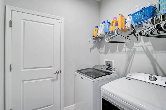 laundry area with laundry area and separate washer and dryer