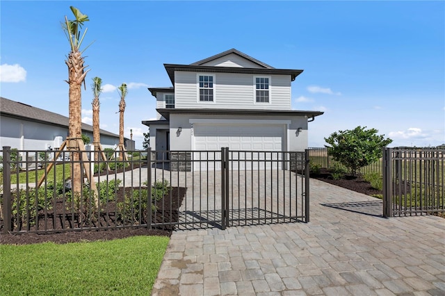 view of front of property featuring a garage, decorative driveway, and fence