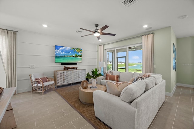 living area with a ceiling fan, recessed lighting, visible vents, and light tile patterned floors