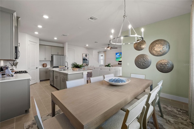 dining room with a ceiling fan, visible vents, and recessed lighting