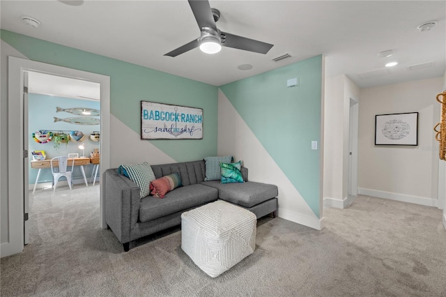 carpeted living area with a ceiling fan, visible vents, and baseboards