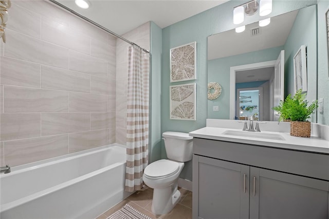 full bath featuring visible vents, toilet, tile patterned floors, shower / bath combination with curtain, and vanity