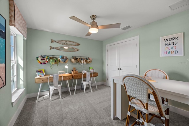 office featuring carpet floors, baseboards, and visible vents