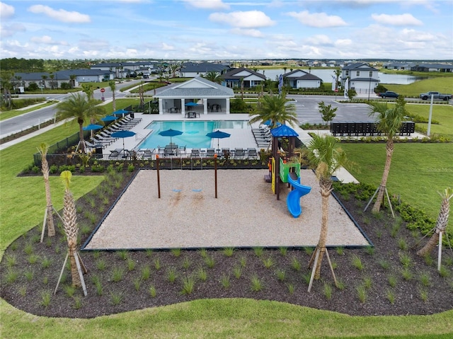 exterior space featuring a yard, a community pool, fence, and a gazebo