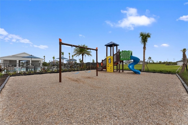 communal playground featuring fence