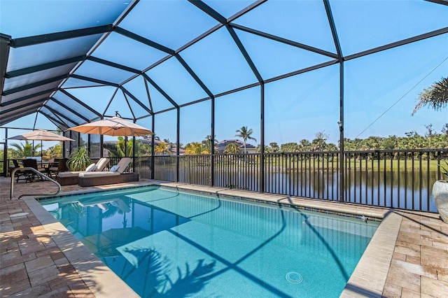 view of pool featuring a fenced in pool, a lanai, a patio area, and a water view