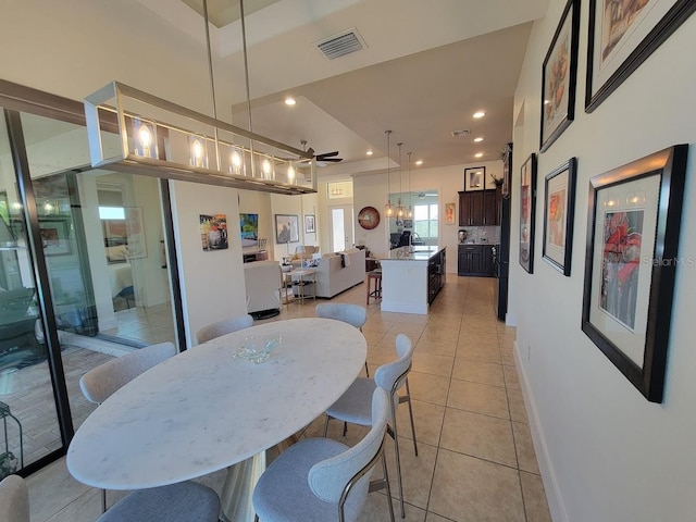 dining space featuring light tile patterned floors, baseboards, visible vents, and recessed lighting