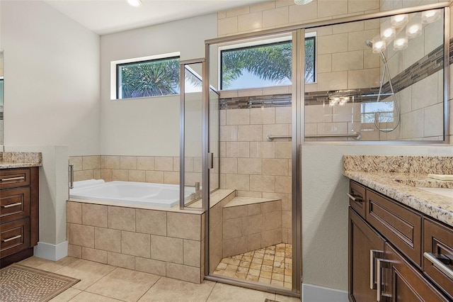 full bath with a garden tub, tile patterned flooring, a shower stall, and vanity