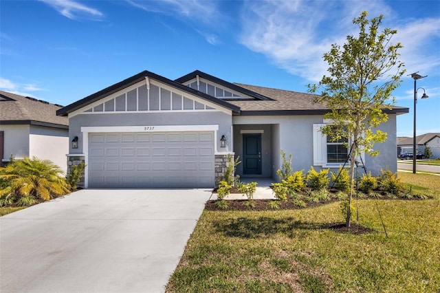 view of front facade featuring a garage, driveway, stone siding, stucco siding, and a front lawn