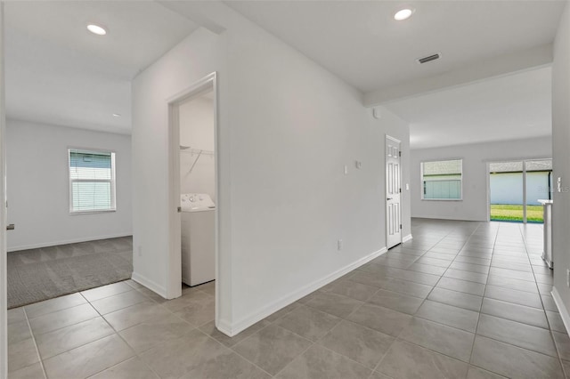 hallway featuring washer / clothes dryer, tile patterned flooring, visible vents, and recessed lighting