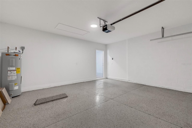 garage featuring a garage door opener and electric water heater