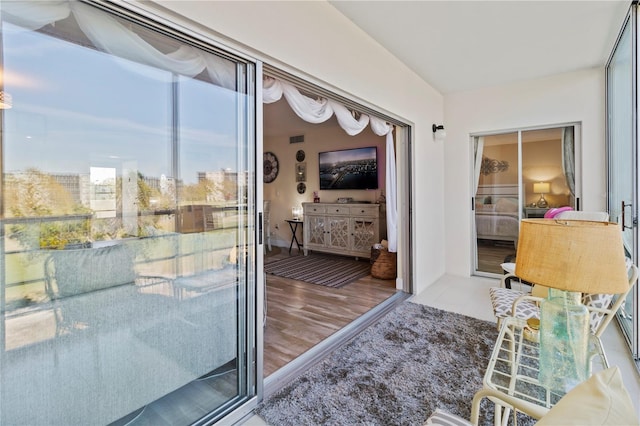 interior space with visible vents and wood finished floors