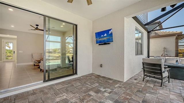 view of patio / terrace featuring a lanai