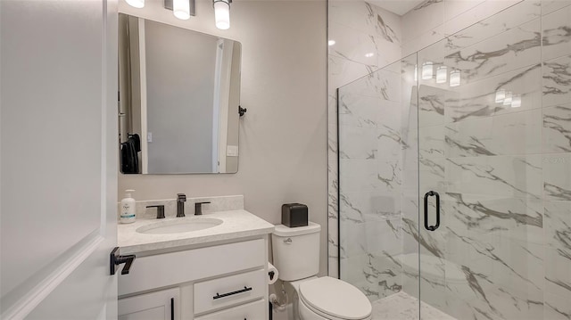 full bath with toilet, a marble finish shower, and vanity