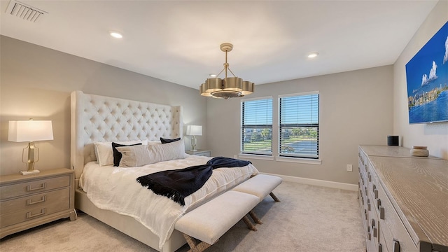 bedroom with light colored carpet, visible vents, baseboards, and recessed lighting