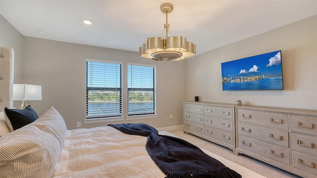 bedroom featuring baseboards and light colored carpet