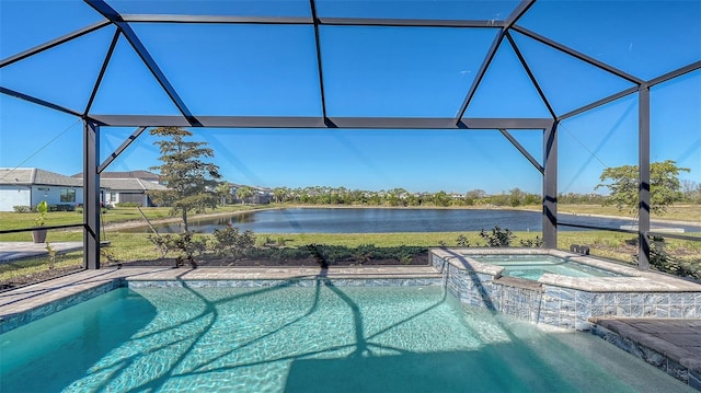 view of pool with a lanai, a water view, and a pool with connected hot tub