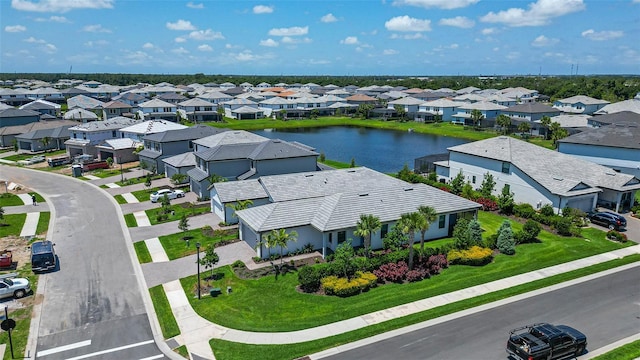 aerial view with a water view and a residential view