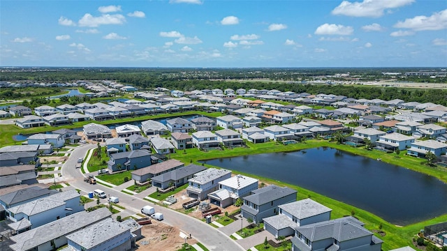 aerial view featuring a water view and a residential view