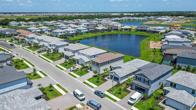 aerial view with a water view and a residential view