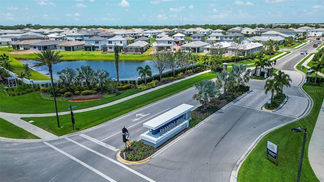 bird's eye view featuring a residential view and a water view