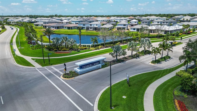 aerial view featuring a residential view and a water view