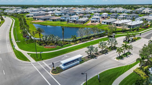 birds eye view of property with a residential view and a water view