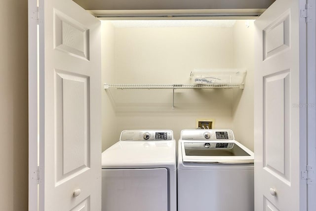 laundry area featuring laundry area and separate washer and dryer