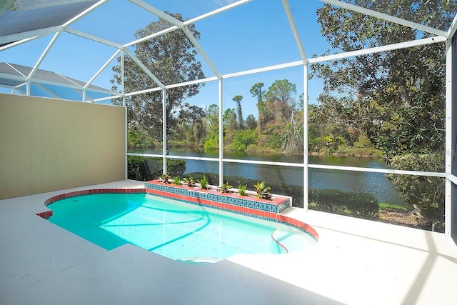 view of swimming pool featuring a patio area, a water view, and a lanai