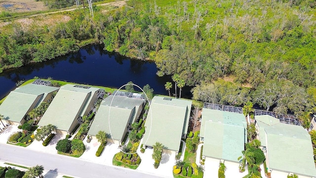 birds eye view of property with a water view and a residential view