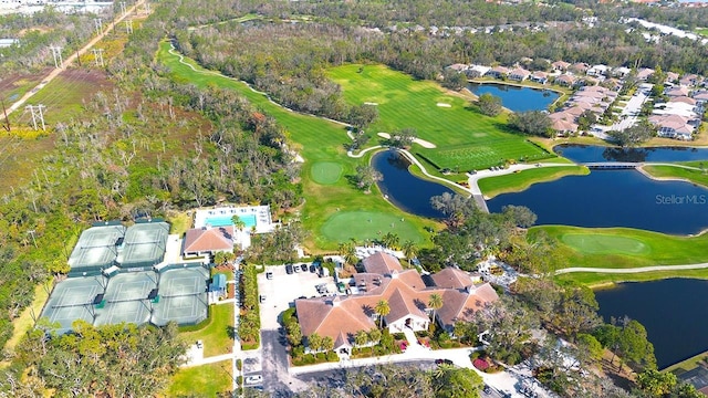 bird's eye view with a residential view, view of golf course, and a water view