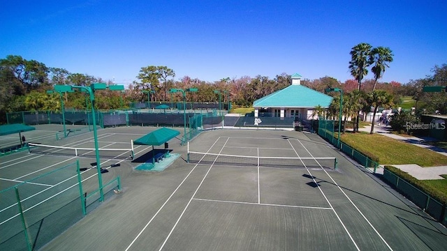 view of sport court with fence