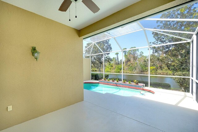 view of pool featuring a water view