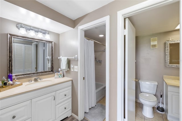 bathroom with visible vents, toilet, shower / bath combo, tile patterned floors, and vanity