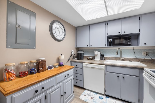 kitchen featuring a sink, white appliances, electric panel, and gray cabinets