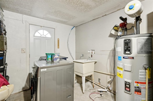 laundry area with a textured ceiling, laundry area, a sink, water heater, and washer and clothes dryer