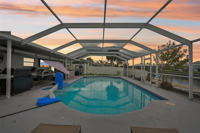 view of pool featuring a patio, a lanai, a fenced in pool, and fence