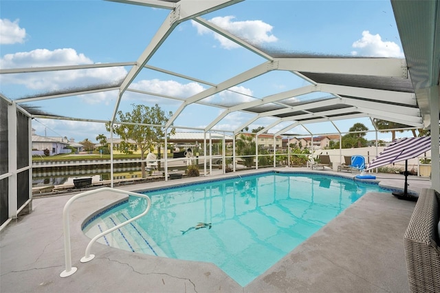 outdoor pool featuring a patio area and a lanai