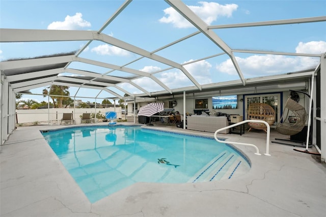 pool with a patio, a lanai, and an outdoor living space